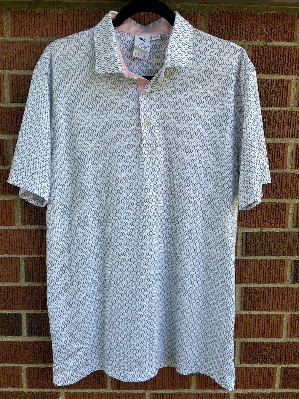Puma Men’s White golf Polo with navy Geo Print and Pink Trim